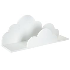 a white shelf with two clouds on it