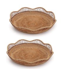 two wicker oval trays on white background