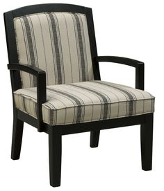 a chair that is upholstered with a striped fabric and black wood trimmings