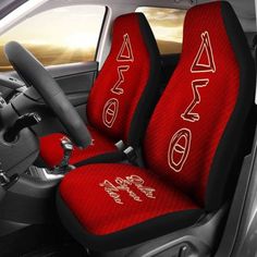 red and black car seat covers with white letters on the front, side and back