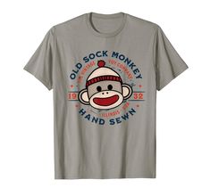 PRICES MAY VARY. Do you love sock monkeys? This Old Sock Monkey Toy Company logo design makes a wonderful choice. Show your love for sock monkeys by wearing this unique graphic tee around town, to an antique show or craft festival. Perfect gift for the sock monkey aficionado or fan of nostalgic toys & collectibles. Great for women, girls or anyone who just loves sock monkeys. Lightweight, Classic fit, Double-needle sleeve and bottom hem Sock Monkey Shirt, Sock Monkey Socks, Crochet Sock Monkey Socks, Sock Monkey Pattern, Crochet Sock Monkeys, Vintage Socks, Monkey T Shirt, Craft Festival, Sock Toys