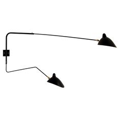 two black lamps on a white background with one light turned off and the other turned down