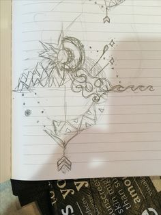 an open notebook with writing on it and a drawing of a dragon in the middle