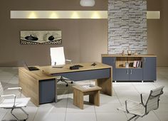 an office desk with two chairs and a book shelf in front of it, along with a stone wall