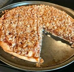 a pie that is sitting on top of a pan with one slice missing from it