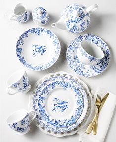 blue and white porcelain dinnerware set on a table