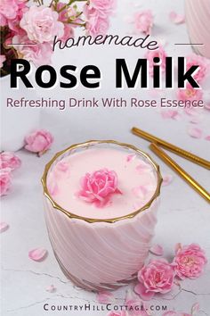 homemade rose milk refreshing drink with rose essentials on the side and pink flowers