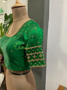 Pure silk blouse with transparent net sleeve. Both the sleeves and neck line is beautifully hand worked with beads, pearls and zardozi. Fabric : rawsilk Neck : U neck front and back Type : Padded blouse/ Can be customize Sleeve- Elbow length Opening : Back hook closure Cotton lining Size : 32, 34, 36, 38, 40, 42, 44 all sizes possible. Standard size-Mention your correct breast round. This is made to order product. We will send a measurement template once you purchase the item. You can provide measurements likewise. If you opt for standard size, please refer to the size chart provided in the listing. If you have any customization please send us a convo. You can customize the color of blouse according to your saree. Festive Blouse With Sheer Sleeves, Green Embellished Blouse For Party, Festive Party Blouse With Embroidered Sleeves, Embellished Green Long Sleeve Blouse, Green Embellished Long Sleeve Blouse, Green Embellished Party Blouse, Fitted Blouse With Sheer Short Sleeves, Festive Green Embellished Blouse, Fitted Blouse With Embroidered Short Sleeves