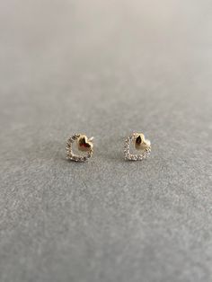 SCREW BACK/14K Solid Gold Tiny CZ Heart Stud Earrings- 14K Solid Gold Quantity: One Pair Color : Yellow Gold Materials : 14K Solid Gold Size : 6mm *14K Solid Gold will not tarnish. *Good for sensitive skin. * Metal components are 14K Solid Gold including earring backs. * Suitable for delicate and sensitive ears. * Comes in a jewelry box. If you need extra boxes for gifting....just let us know! Gold Heart-shaped Earrings With Diamond Accents, Gold Heart Shaped Earrings With Diamond Accents, Silver 14k Gold Heart Earrings For Anniversary, Tarnish Resistant Open Heart Earrings For Anniversary, Open Heart Tarnish-resistant Earrings For Anniversary, Tarnish-resistant Open Heart Earrings For Anniversary, Gold Heart Earrings With Diamond Accents For Gift, Gold Double Heart Earrings With Diamond Accents, Gold Heart Earrings With Diamond Accents For Formal Occasions