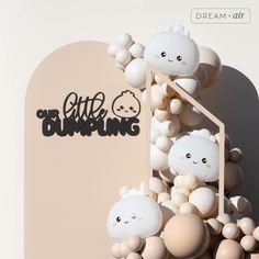 an artistic display with balloons and letters on the wall that say little blingg