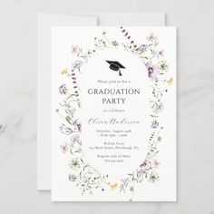 a graduation party card with flowers and a mortar cap in the center, on top of a white background