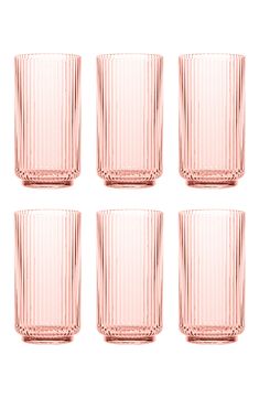 six pink glass tumblers sitting next to each other