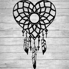 a black and white photo of a heart shaped dream catcher