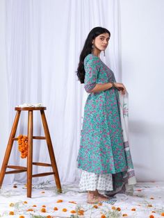 For the upcoming wedding season this suit set is a perfect to wear in morning mehndi or roka function. It comes with a V-neck detailing, giving it a rich look. It is paired with a beautiful hand-block printed dupatta giving it a complete elegant look. 100% Premium Cotton Printed Suit Set Hand-block Printed Dupatta Comfort fit Set Contents: 1 Kurta, 1 Dupatta, 1 Palazzo Model height is 5.7 feet and is wearing size M Wash Care Instructions: Dry Clean Only Note: The product will be delivered within Unstitched Suit With Block Print For Wedding, Wedding Cotton Sets With Block Print, Cotton Block Print Wedding Sets, Wedding Cotton Block Print Sets, Festive Cambric Block Print Sets, Festive Cambric Sets With Block Print, Fitted Mulmul Anarkali Set With Straight Kurta, Bollywood Cotton Palazzo Set For Wedding, Wedding Straight Kurta Set In Cambric