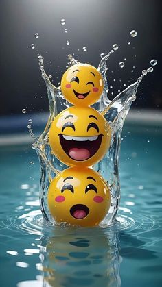 three smiley faces are splashing in the water