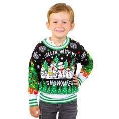 a young boy wearing an ugly christmas sweater