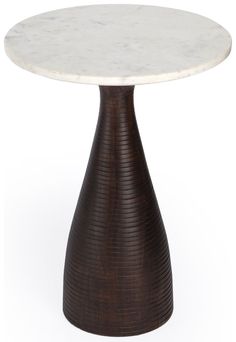 a white marble top table with a brown metal base and wavy lines on the bottom