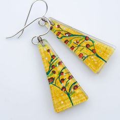 Vine is part of the FLORA&FAUNA collection. The warm summer colors bring to mind Tuscan landscapes, sunshine, mustard-colored stucco houses in the countryside.All of our dangle earrings are finished with premium Argentium silver wires and include a pair of silicone ear backs. Argentium silver is a step up from sterling silver; it is 100% nickel-free.Dimensions: 0.6" x 1.35" ; 15mm x 34mm Hand Painted Yellow Earrings For Summer, Vintage Yellow Earrings For Summer, Vintage Yellow Summer Earrings, Stucco Houses, Tuscan Landscaping, Fused Glass Earrings, Stucco Homes, Light Weight Jewelry, Climbing Vines