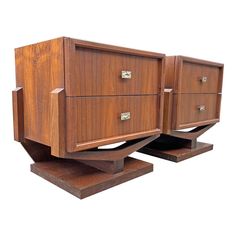 two wooden dressers sitting on top of each other