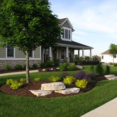 a house with landscaping in the front yard