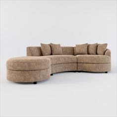 a curved sectional sofa with pillows on the top and bottom ends, sitting in front of a white background