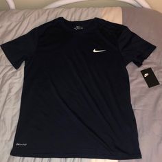 Brand New Nike Sporty Navy Top, Sporty Navy Nike Top, Navy Sporty Crew Neck Shirt, Navy Sporty Shirt With Crew Neck, Sporty Navy Shirt With Crew Neck, Navy Moisture-wicking Crew Neck Top, Navy Crew Neck Top With Moisture-wicking, Nike Navy T-shirt With Graphic Print, Nike Navy T-shirt For Sports