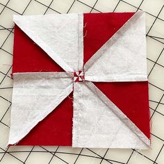 a red and white quilted piece of fabric