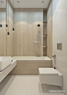 a bathroom with a tub, toilet and sink