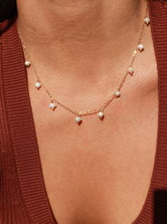 This lightweight and delicate piece features dangle pearl charms that make it perfect for both everyday wear and special occasions. The adjustable length ensures a comfortable fit, while the PVD plated finish ensures that your necklace stays water safe and tarnish resistant. Create a chic and minimal pearl look by layering the Calypso Necklace with your favorite pieces. •Single Necklace• Faux Pearls• 15.5" + 2" extender (to make adjustable) Single Necklace, Pearl Look, Everyday Wear Jewelry, Pearl Charm Necklace, Dangle Necklace, Dangle Necklaces, Pearl Charms, Dangle Charms, Steel Jewelry