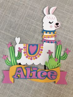 a paper cut out of an alpaca with the word alice on it's side