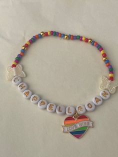 🤍Chappell Roan friendship bracelet because we all belong at the Pink Pony Club 💖 🤍 Rainbow beads, iridescent cream butterflies, gold spacers, rainbow heart "love wins" charm and gold letters  🤍 Perfect for the tour or as a gift 🤍 Comes beautifully wrapped  🤍 Made by your favourite disabled maker ✨ Multicolor Inspirational Jewelry For Friendship, Inspirational Multicolor Friendship Jewelry, Spiritual Rainbow Beaded Friendship Bracelets, Meaningful White Friendship Bracelets, Princess Love, Pink Pony Club, Love Wins, Pony Club, Chappell Roan