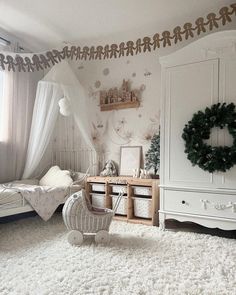 a bedroom with white carpet and christmas decorations on the walls, bedding and dressers