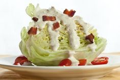 lettuce salad with bacon and ranch dressing on top