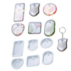 a set of six plastic trays with key chains and magnets attached to them