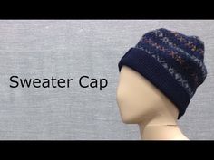 a mannequin head wearing a knitted hat with the words sweater cap on it