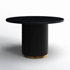 a black and gold round table on a white background with an empty space in the middle