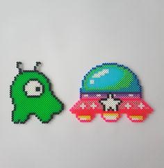 two pieces of bead art depicting an alien and a space ship on white background