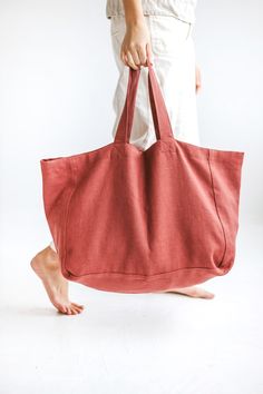 "The texture of the linen fabric is what makes this beach bag so unique. Made of natural linen that feels lovely to the touch. The bag has an extra linen lining, so it can withstand heavier items. There are two pockets inside for your phone, wallet, and other accessories. Perfect bag for a long-awaited summer holiday, picnic, or trip to the beach. * Which is your favorite color? Terracotta / Olive / Ocean. Beach bag approx. size: Height: 35 cm / 14\" Length: 45 cm / 18\" Width: 22 cm / 9\" Handl Large Bags For Women, Anne Carlson, Terracotta Linen, Summer Bags Beach, Linen Bags, Perfect Beach Bag, Diy Bags Purses, Linen Summer, Oversized Tote Bag