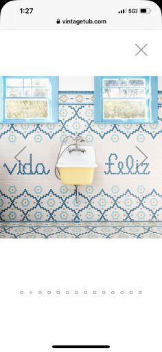 an image of a room with blue and white wallpaper