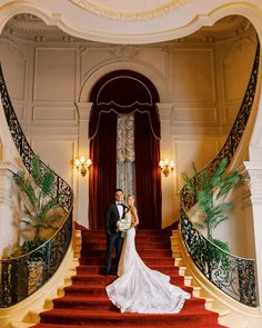 Couple poses on staircase at an elegant luxury wedding venue. Dramatic Curtains, Luxury Wedding Ideas, Timeless Wedding Photos, Iron Railings, Vintage Light Fixtures, Luxury Wedding Venues, Iron Railing