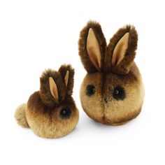 two stuffed bunnies sitting next to each other