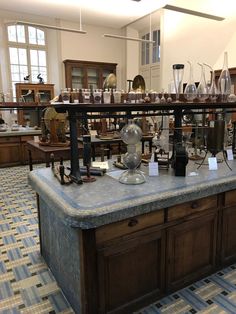 a room filled with lots of glassware on top of a counter