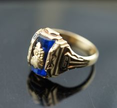 This is the perfect option for those who like cool, unique jewelry and the luxury, shine of gold, blue. This ring is well made, cute and/or elegant in design, and very desirable. Vintage ring decorated with the blue stone in the center and signed A -1955-6 The ring has a hallmark, 10k Josten. Its weight is 4.9 grams and is a size 6 3/4. In good condition. Every one interested in the jewelry should remember that he or she must like their jewelry- not just at first sight.... but for always. To hav Heirloom Blue Sapphire Birthstone Ring, Formal Blue Signet Ring, Formal Blue Hallmarked Signet Ring, Blue Polished Signet Ring As Gift, 14k Gold Sapphire Signet Ring As Gift, Sapphire 14k Gold Signet Ring Gift, Blue Signet Ring With Polished Finish As Gift, Blue Signet Ring With Polished Finish For Gift, Blue Polished Finish Signet Ring As Gift