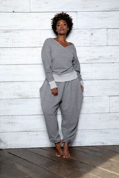 CLASSIC  SWEATSUIT - JIBRI     PANT Relaxed fit Exaggerated Hip Drape Side Pockets Inseam 32 High waist Invisible back zipper TOP Relaxed Fit V Neck with long sleeves Contrast ribbed finish Fabrication: French Terry Sizing: True to Size (View Size Chart) Handmade in Atlanta, GA Outfits To Wear With Sweatpants, Plus Size Lounge Wear Outfit, Plus Size Body Types, Sweat Suits Outfits, Sweatsuit Outfits, Grey Sweatsuit, Classic Gray, Sweatsuit Set, Comfy Sweaters