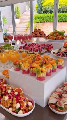 a table filled with lots of different types of food and drinks on it's sides