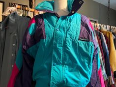 It's a hot tub time machine....go back in time with this retro color block ski jacket Swag Listed 1- Retro Ski Jacket, poly insulated, she is puffy and so cool,  size 10, has a tag for ski free validation November 1 1989 thru June 15, 1990.  Colors are bright, not sure how much slope action this jacket has seen, just waiting for you to bring it to the slopes! numbers matters-see pics Link to more Swag https://www.etsy.com/shop/406VintageSwag?ref=seller-platform-mcnav All store items are unique vintage or antiques that have had normal use. I have described as much as possible but, straw marks, tiny white/black spots, flea bites, which can happen in the manufacturing process, and very small scratches, paint losses, etc are not listed. Most of my pieces are in Good used vintage condition. I t Retro Multicolor Outerwear For Outdoor Activities, Retro Outerwear For Ski Season, Retro Outerwear For Snowboarding, Vintage Ski Outerwear For Ski Season, Retro Ski Season Outerwear, Retro Ski Season Windbreaker, 90s Ski Jacket, Vintage Windbreaker For Ski Season, Hot Tub Time Machine