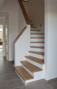 a set of wooden stairs in a house