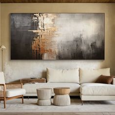 a living room filled with furniture and a painting on the wall