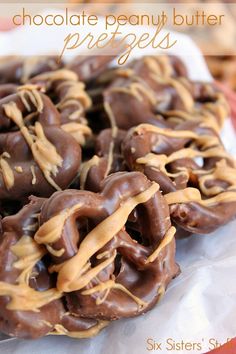 chocolate peanut butter pretzels on a white plate with text overlay that reads, chocolate peanut butter pretzels six sisters