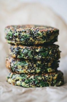 there are three cookies stacked on top of each other in the shape of circles with spinach and cheese